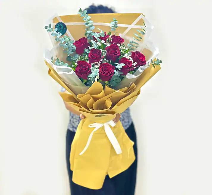 9 Red Roses and Fillers arranged in a Bouquet